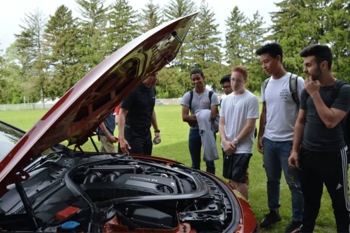 New Milford sophomores learn about cars from BMW Corporate.
