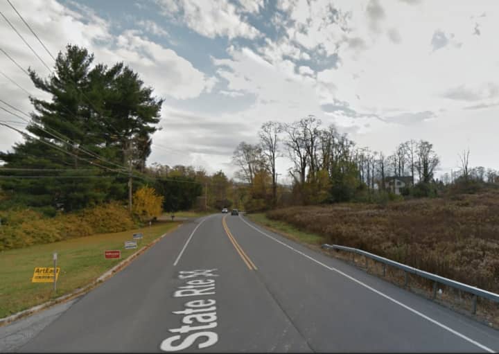 A man said he was hit by a car while riding his bike on Route 55.