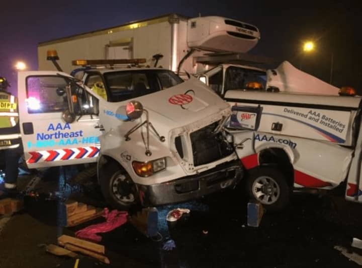 Two people are trapped after a crash involving a AAA tow truck on I-95 south in Fairfield on Friday night.