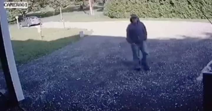 The suspect in a Trumbull burglary on Sunday — an unknown male wearing blue jeans, a gray-colored hooded sweatshirt, and a baseball hat — was captured on home surveillance before cutting the wires.