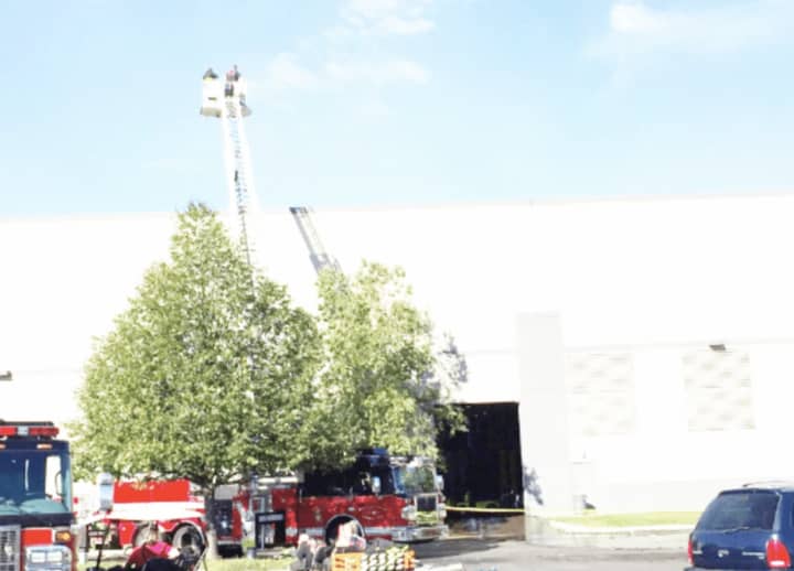 Firefighters dousing hot spots at the fire at the Gap Inc. clothing distribution center in Fishkill last year.