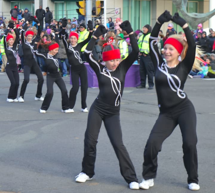 The Westport Weston Family Y Showtime Exhibition Gymnastic Team tumbled its way down the route at the Stamford Downtown Parade Spectacular.