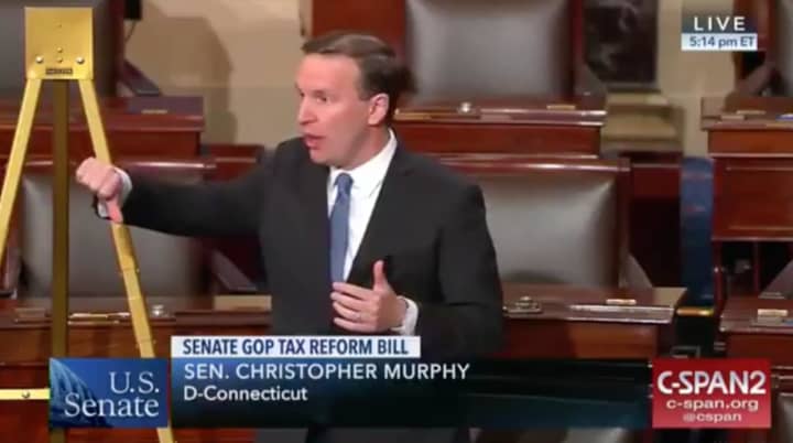 U.S. Sen. Chris Murphy (D-Conn.) speaks on the Senate floor Friday. He said the Senate was about to vote on a tax bill that it had not yet seen. The measure passed early Saturday.