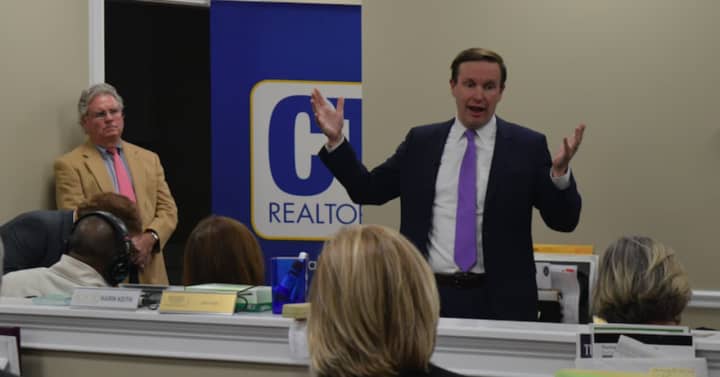 U.S. Sen. Chris Murphy took questions about the crisis in Puerto Rico at a community forum on the new federal tax bill Friday in Fairfield.