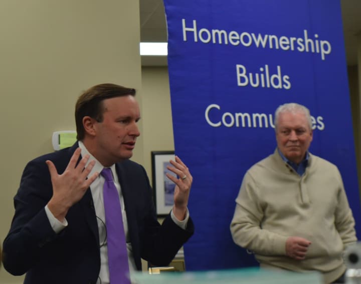 U.S. Sen. Chris Murphy, left, and Fairfield First Selectman Mike Tetreau discuss new federal tax law with real estate agents and homeowners in Fairfield Friday.