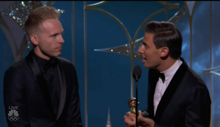 Justin Paul and Benj Pasek accept the Golden Globe for Best Original Song in a Motion Picture on Sunday night. They won for the song &quot;This is Me&quot; from the P.T. Barnum movie &quot;The Greatest Showman.&quot;