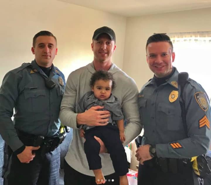 Officers Brad Gilmoure and Kenneth Knebl and Sgt. Justin Tress met baby Lyon Judah Garcia at his home on Sunday.