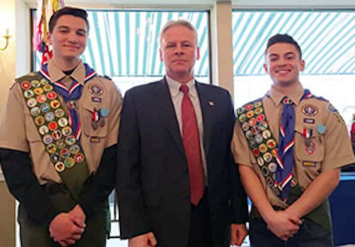 Eagle Scouts Gregory Yovane, left, and Jason Garofalo, right, with Putnam County Undersheriff Michael F. Corrigan.