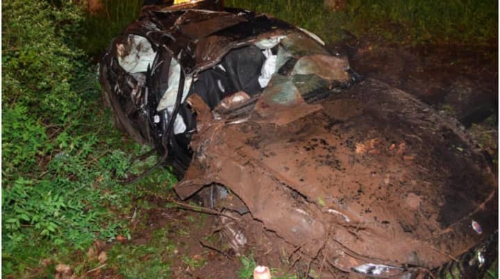 Photos released by state police shows the heavily damaged Maserati.