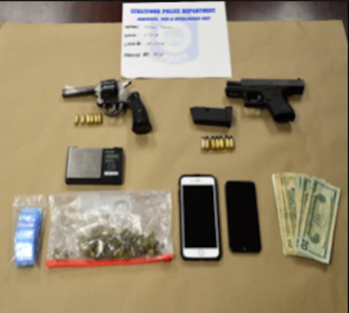 Guns, drugs and cash seized during the bust.