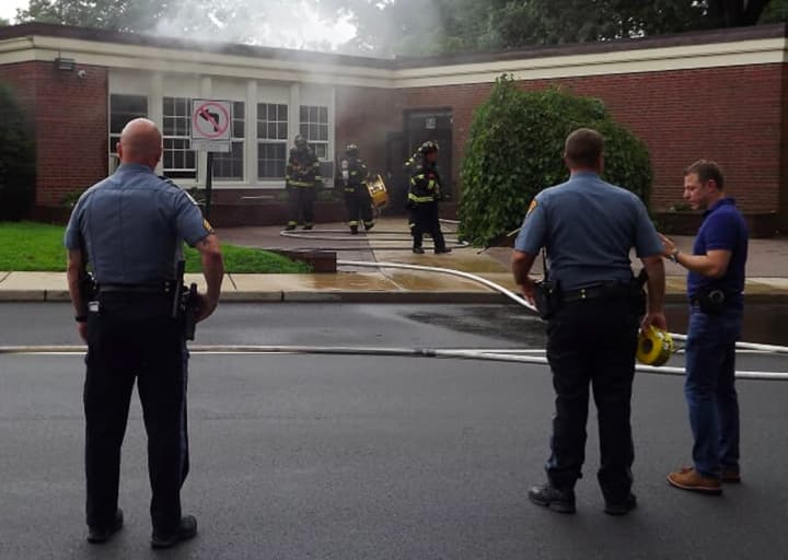 Firefighters are working to determine the cause of a fire that heavily damaged at least one classroom on the first floor of a Ridgewood elementary school on Wednesday morning.