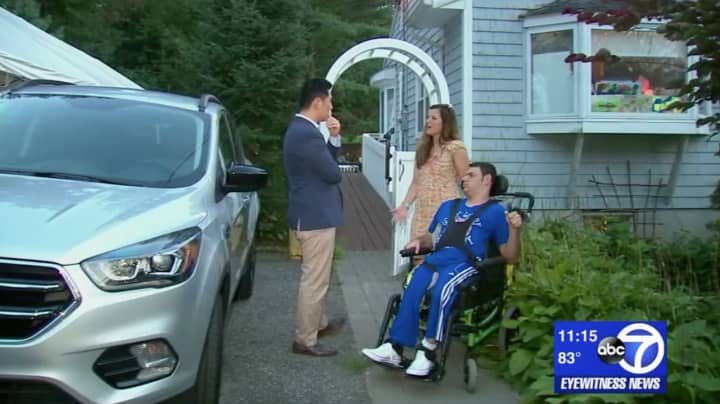 <p>Ryan Gotto and his mother in their driveway, where his handicapped-accessible van was stolen.</p>