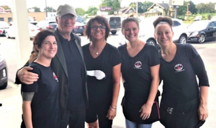 Actor Richard Gere poses for a photo with the staff at Julie&#x27;s Diner on Saturday. From left, Jeanette Bova, Gere, diner owner Kristen Macko, Megan Skinner and Jen Cruz.