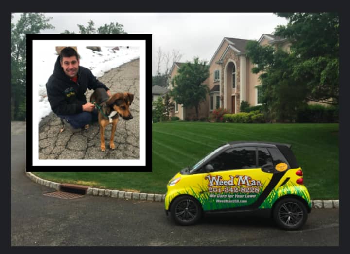 Weed Man Lawn Care owner Joseph Dillon with puppy Kona.