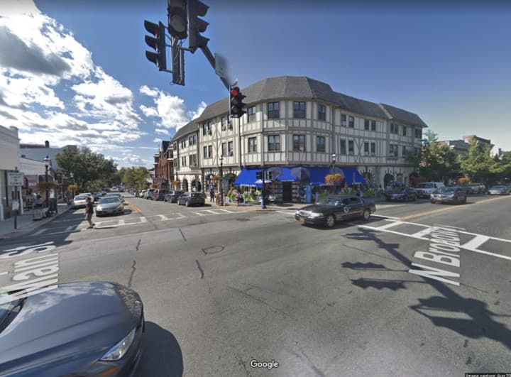 A parking enforcement officer was hit by a vehicle at this busy intersection in Tarrytown.