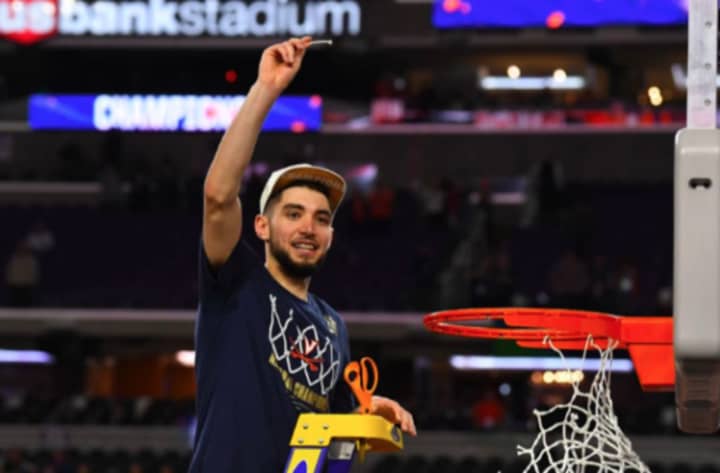 Former Westchester high school basketball star Ty Jerome cutting down the nets after winning the NCAA Championship.