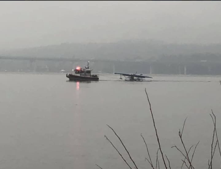 A look at the small plane being towed to the Tarrytown Marina.