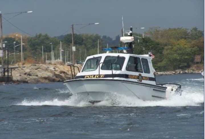 Police aboard Westport Marine 1 was used in the rescue of four men clinging to a partially submerged boat that was spotted by a nearby oyster boat Tuesday, June 18 in the Long Island Sound near Peck&#x27;s Ledge Lighthouse.