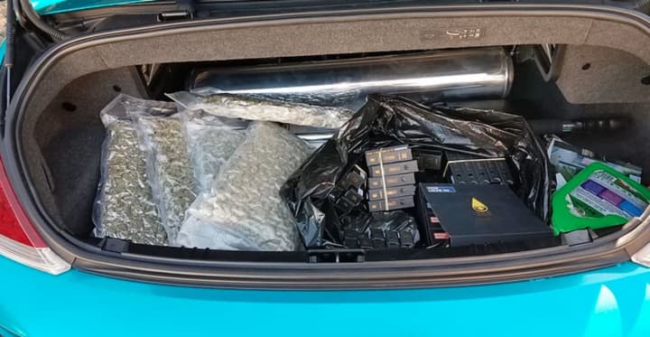 Sean Bell, 26, of Patchogue was charged after police say he was found to be in possession of 150 flavored vape cartridges containing THC and approximately 2.5 pounds of marijuana located in five vacuum-sealed bags in the trunk.