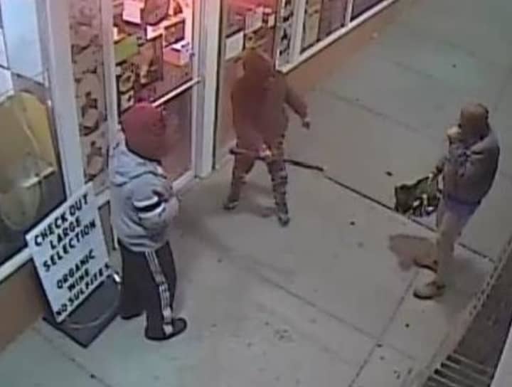 Three men are at large after breaking into a Smithtown liquor store with a baseball bat.