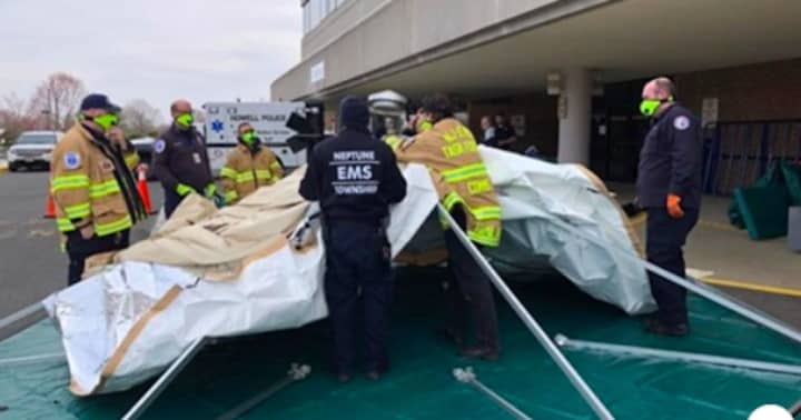 Monmouth County EMS crews set up &quot;surge tents&quot; to help screen patients arriving at CentraState Medical Center in Freehold and Jersey Shore University Medical Center in Neptune City.