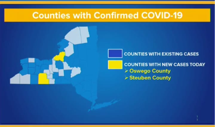 Confirmed cases by county (in blue) with counties reporting new cases the last 24 hours in yellow.