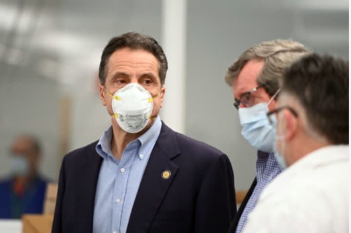 New York Gov. Andrew Cuomo, and Northwell Health President and CEO Michael Dowling (center), wore masks on Sunday, April 19 on Long Island at  the Northwell Health Core Lab in New Hyde Park.