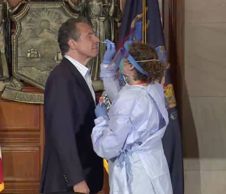New York Gov. Andrew Cuomo gets tested for COVID-19 during his daily news briefing on Sunday, May 17. The test came back negative, Cuomo said on Monday, May 18.