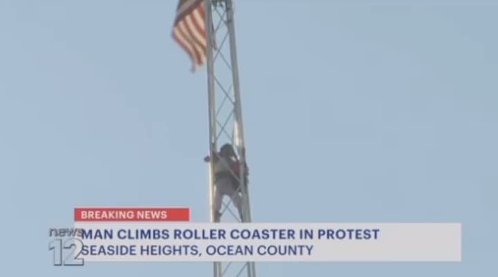 Man named &quot;Chris&quot; atop Casino Pier &quot;Skyscraper&quot; tower ride at Casino Pier in Seaside Heights.