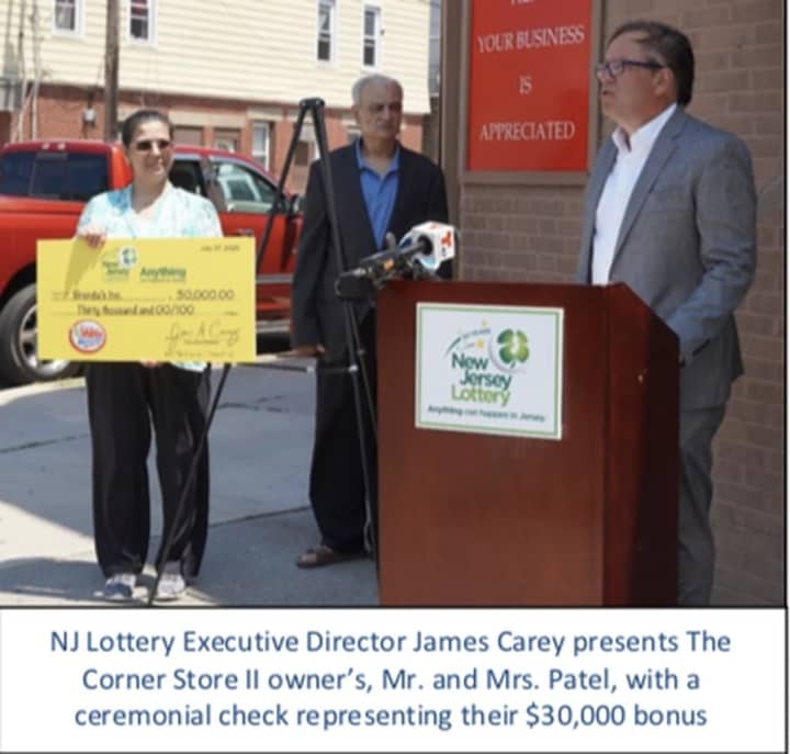 Vijaykumar Patel, owner of Brenda’s Inc. on Kennedy Boulevard in Bayonne -- also known as The Corner Store II -- accepted the check from NJ Lottery Executive Director James Carey.