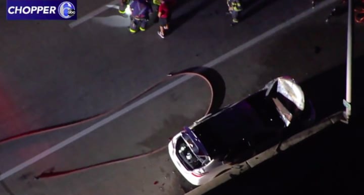 A car burst into flames on Wednesday night along I-295 in Hamilton Township. (Chopper6 ABC News Philly)