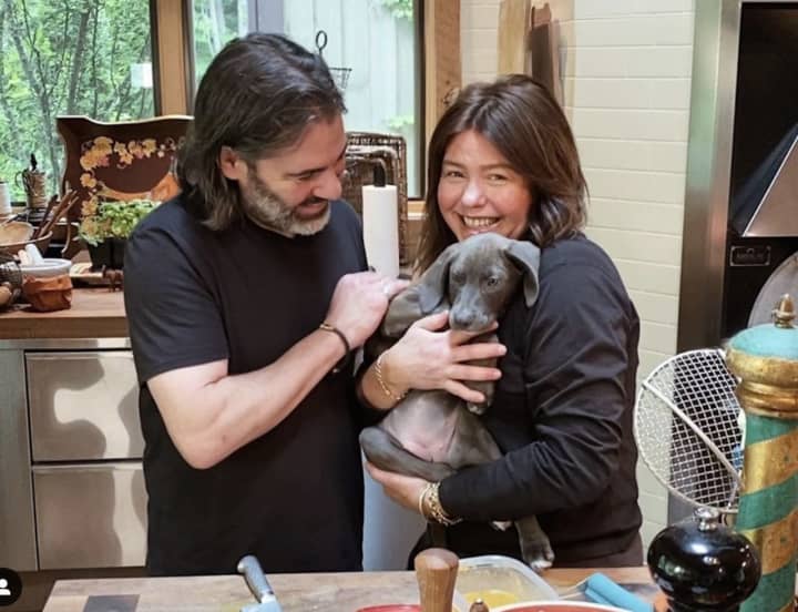 Celebrity chef Rachael Ray, her husband John Cusimano, and the family’s dog, Bella Boo, at the upstate New York home in Lake Luzerne on June 22 in a photo she posted on Instagram. All three escaped from the fire on Sunday, Aug. 9.