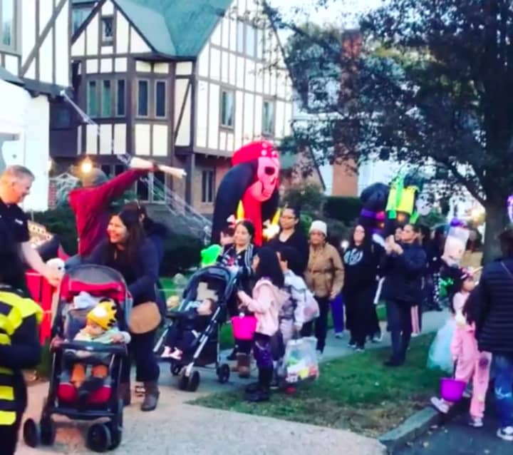 Throngs of trick-or-treaters mob Clinton Place in Hackensack.