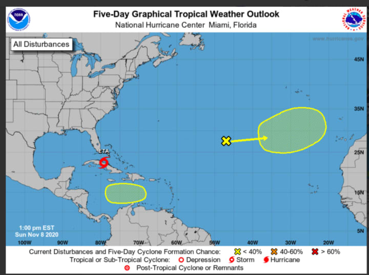 A look at Tropical Storm Eta (marked in red) and a low-pressure system has developed in the Atlantic Basin (marked in yellow).