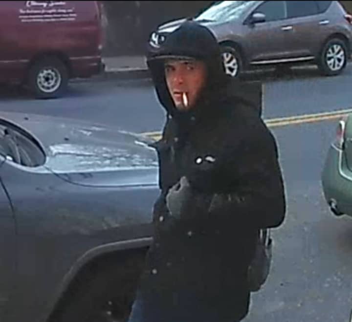 The masked suspect pictured above stole a package that had been delivered to a home on the 1100 block of E. 4th Street sometime on Wednesday, police said.