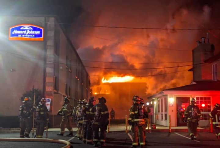 Firefighters battle a four-alarm blaze at the Howard Johnson Express Inn in Blackwood.