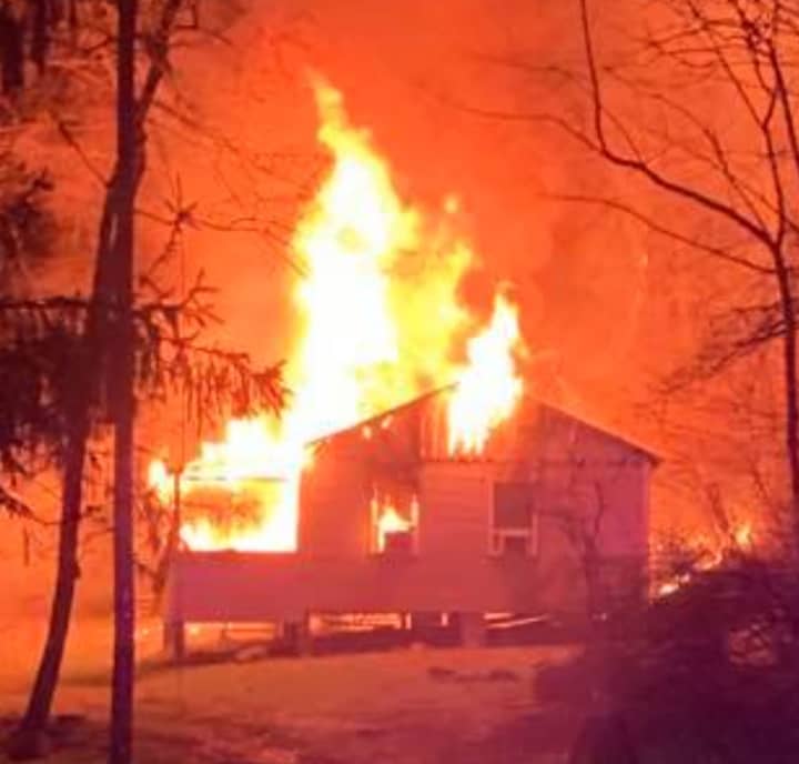 It took more than 62,000 gallons of water to douse a fire that broke out at a building of a Sussex County camp Wednesday night, authorities said.
