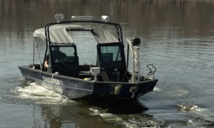 The Chicopee Police Department searching the river.
