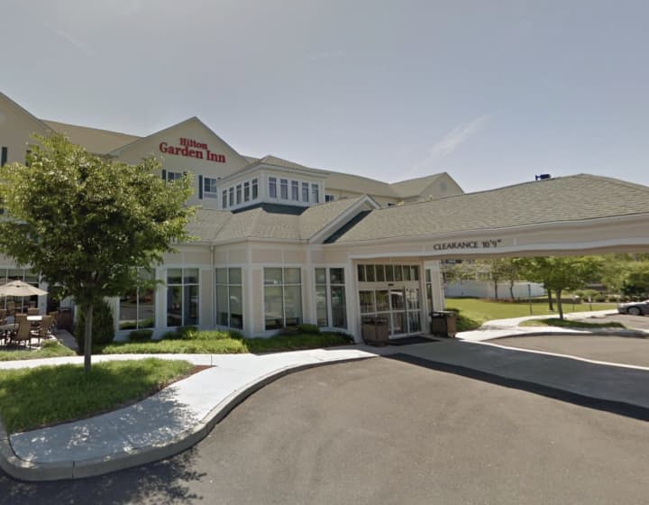 A man was arrested at the Hilton Garden Inn in Milford for allegedly attacking a pregnant woman.