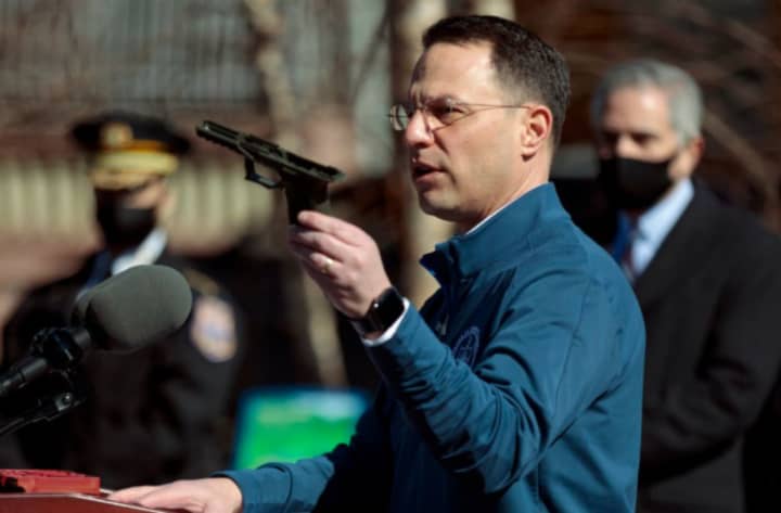 PA Attorney General Josh Shapiro holds up a ghost gun seized in March out of Berks County.