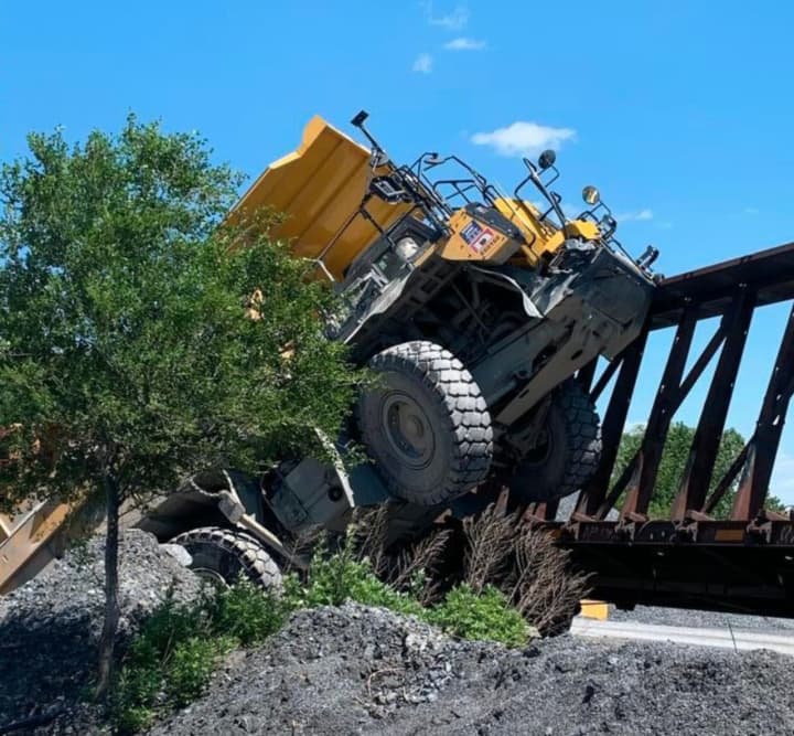 A dump truck driver had to be removed by first responders but was uninjured after crashing head-on into a train on the Upper and Lower Nazareth line Thursday afternoon, authorities said.