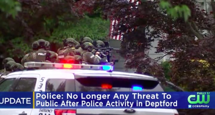 SWAT team members descend on a standoff in Gloucester County. (Courtesy of CBS Eyewitness News Philly)