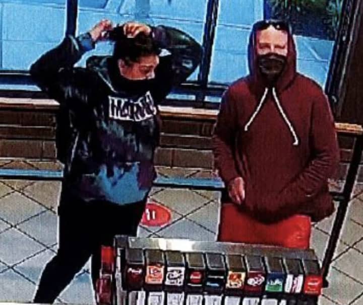Police released surveillance photos of suspects who allegedly stole a car from Chick-Fil-A in Farmingdale.