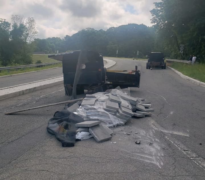 A trailer overturned Monday morning and shut down a main road in Sussex County, authorities said.
