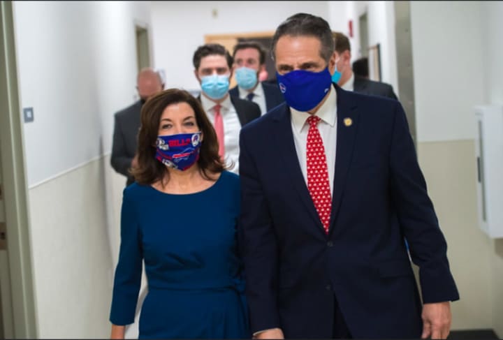 Gov. Kathy Hochul with her predecessor, Andrew Cuomo, on way to a COVID-19 news briefing update in Buffalo on Monday, Jan. 25, 2021, their last known public appearance together.
