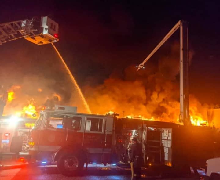 Explosions rocked the U.S. Auto Auction building which was destroyed by fire Tuesday night.
