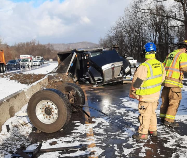 A dump truck overturned and shut down Route 78 Tuesday morning, authorities said.