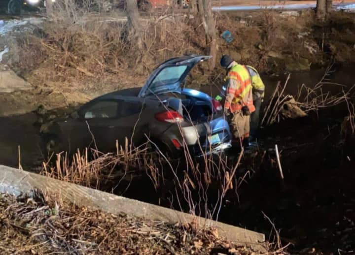 A car veered off the road and plunged into a creek in Phillipsburg before dawn Thursday, authorities said.