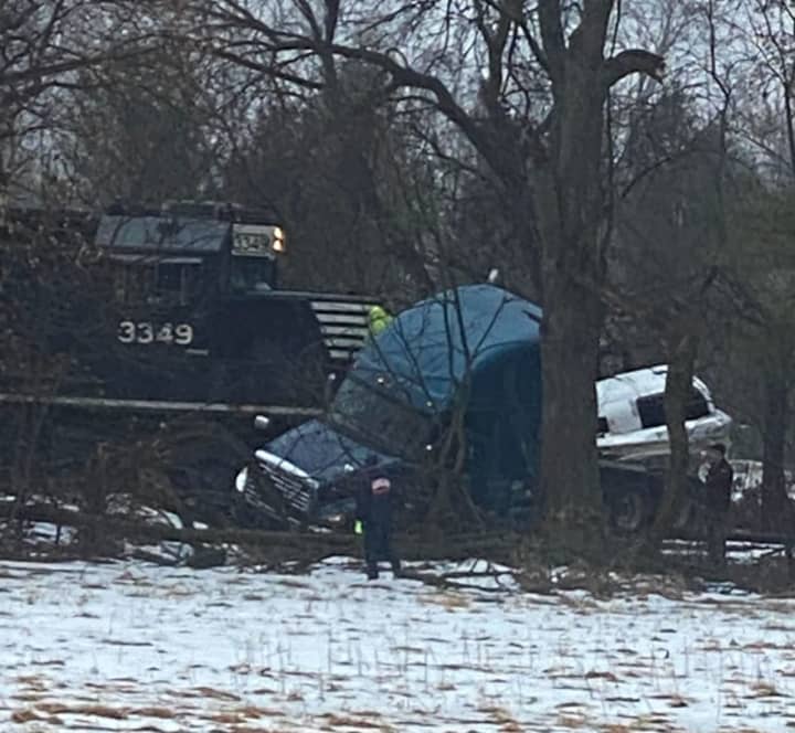 A tractor-trailer driver was hospitalized after the vehicle collided with a train and shut down a major Lehigh Valley highway Thursday morning, state police confirmed.