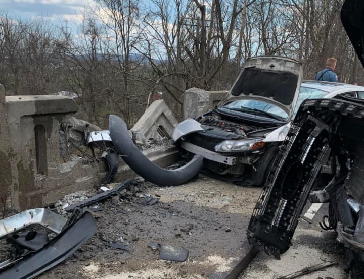 A two-car crash brought traffic to a halt on Route 22 and damaged a bridge in the Phillipsburg area Thursday afternoon, authorities said.